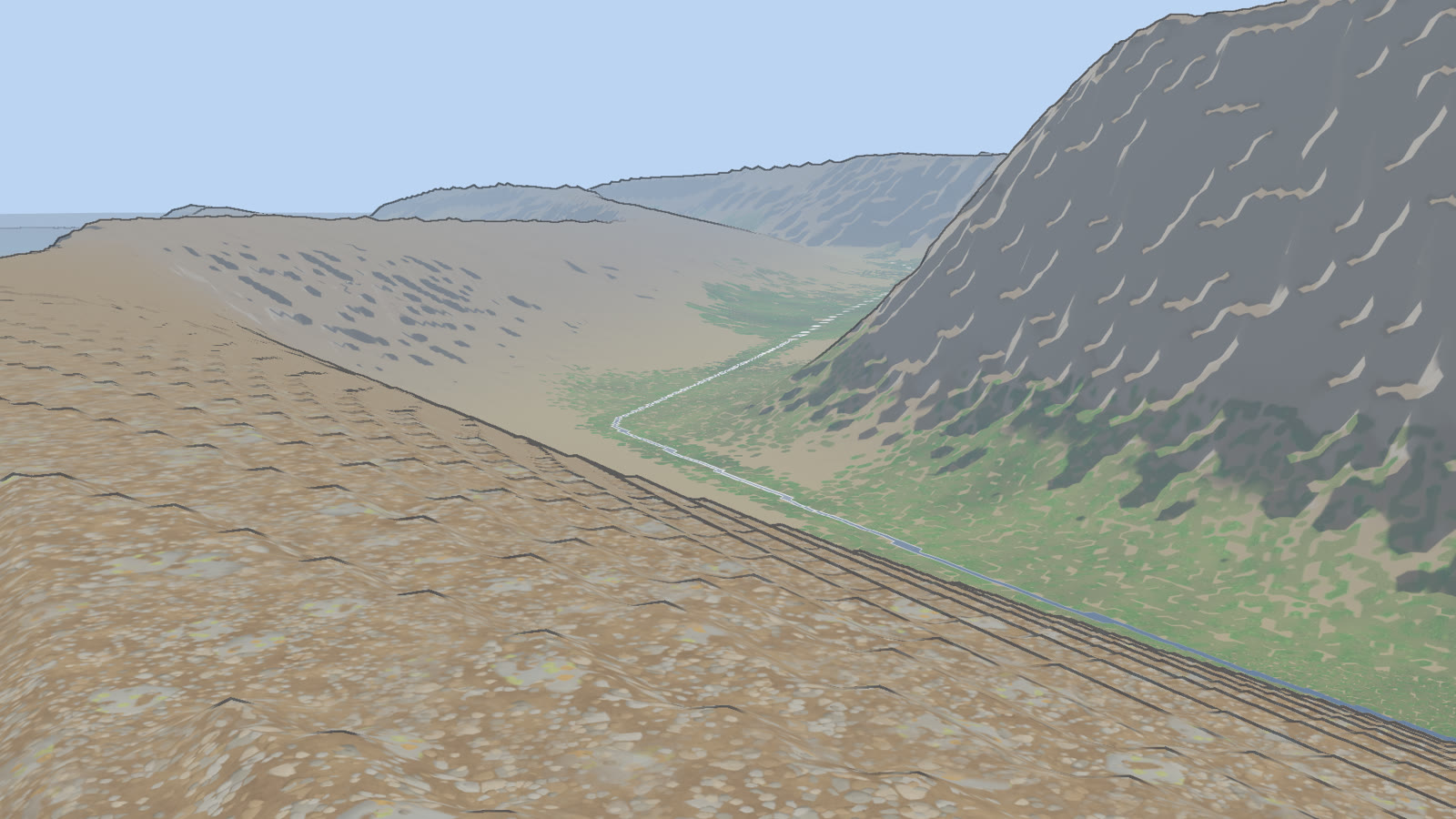 A river running down the trough at the foot of a ridge